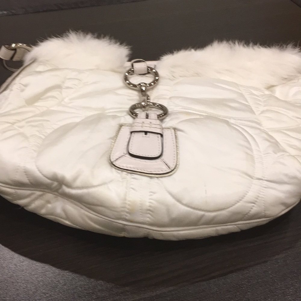 Quilted puffer coach bag with fur trim